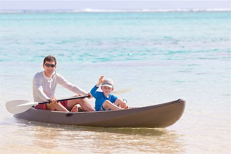 family boat canoe - handsome smiling father and his cheerful little son at the kayak during vacation Stock Photo - Budget Royalty-Free & Subscription, Code: 400-07509708