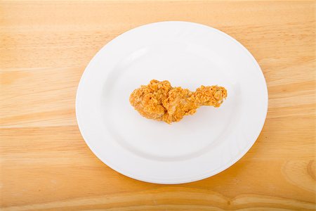 dbvirago (artist) - A piece of fresh, crunchy fried chicken on a white plate Fotografie stock - Microstock e Abbonamento, Codice: 400-07501375