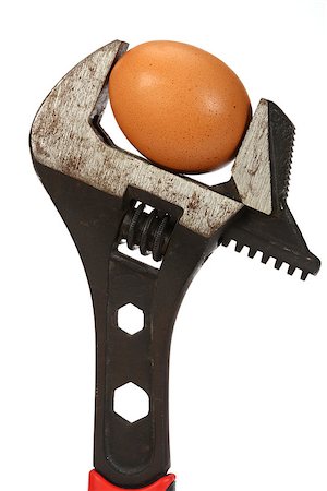 egg (concept) - Wrench and a egg close up over white Stock Photo - Budget Royalty-Free & Subscription, Code: 400-07501394