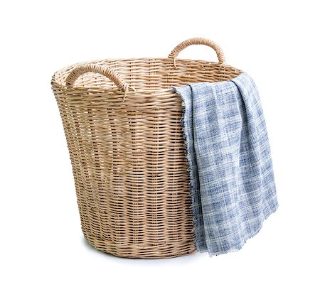 rattan basket - cloth in wicker basket on white blackground Stock Photo - Budget Royalty-Free & Subscription, Code: 400-07501759
