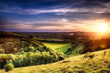 Winchester hill sunset across folding farmland and trees Foto de stock - Royalty-Free Super Valor e Assinatura, Número: 400-07502699