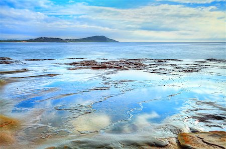 simsearch:400-07514503,k - Reflections in the shallow rock pools and lots of different textures in the rocks.  Terrigal Haven NSW Australia Stock Photo - Budget Royalty-Free & Subscription, Code: 400-07502868