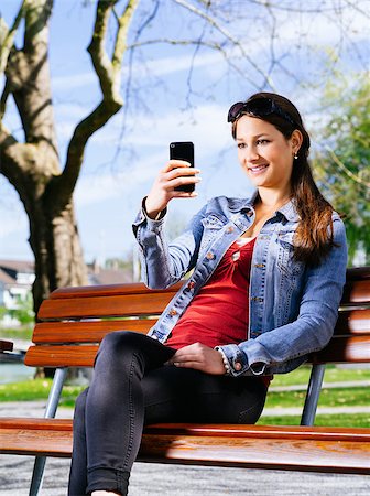 Photo of a beautiful young woman using a smart phone to take photos. Stock Photo - Budget Royalty-Free & Subscription, Code: 400-07503281