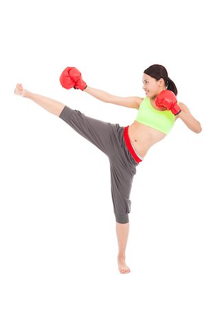 pretty sporty woman is kicking and punching Stock Photo - Budget Royalty-Free & Subscription, Code: 400-07503423