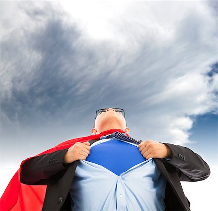 Businessman imitate superman to pull his t-shirt open Stock Photo - Budget Royalty-Free & Subscription, Code: 400-07503513