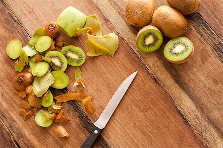 stockarch (artist) - Overhead view of a wooden kitchen counter with a knife for preparing fresh tropical kiwifruit for a delicious dessert Stock Photo - Budget Royalty-Free & Subscription, Code: 400-07503892