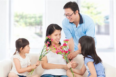 Daughters and father celebrating mother's day Stock Photo - Budget Royalty-Free & Subscription, Code: 400-07514163