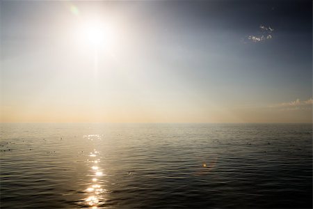 Beautiful sunrise over the sea. Calm. Fotografie stock - Microstock e Abbonamento, Codice: 400-07515244