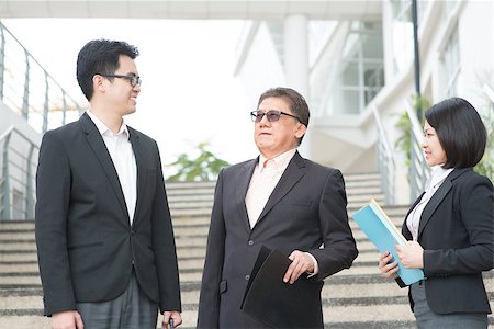 simsearch:400-07515329,k - Asian business team meeting, having discussion outside office. Stock Photo - Budget Royalty-Free & Subscription, Code: 400-07515306