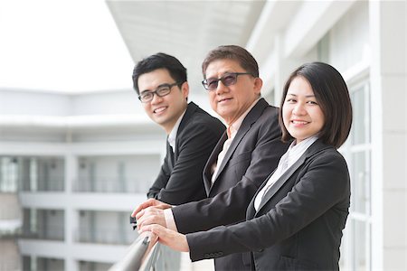 simsearch:400-07515329,k - Asian business team. Group of businesspeople chatting outside office. Stock Photo - Budget Royalty-Free & Subscription, Code: 400-07515319