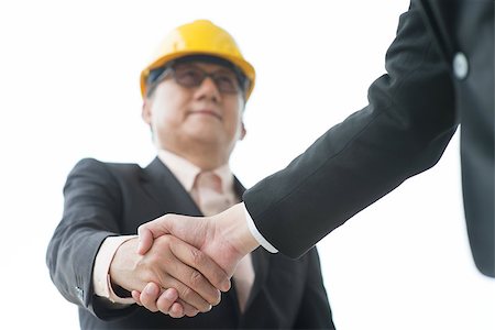 Senior male architects with hardhat hand shaking. Stock Photo - Budget Royalty-Free & Subscription, Code: 400-07515323