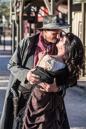 simsearch:400-07516134,k - Portrait of an old west woman and sheriff kissing Stock Photo - Budget Royalty-Free & Subscription, Code: 400-07516132