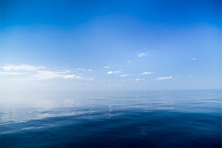 Beautiful sunny day with blue sky over the sea. Calm. Fotografie stock - Microstock e Abbonamento, Codice: 400-07516286
