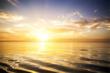 Beautiful sunrise over the sea. Calm. Fotografie stock - Microstock e Abbonamento, Codice: 400-07516283