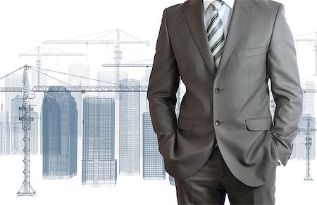 simsearch:400-07614731,k - Businessman in suit. Wire frame tower crane and skyscrapers on the background Stock Photo - Budget Royalty-Free & Subscription, Code: 400-07517418