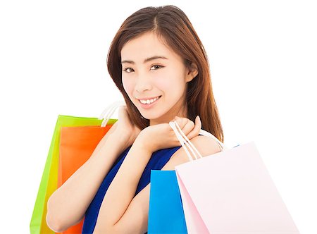 smiling young  asian woman with shopping bags Stock Photo - Budget Royalty-Free & Subscription, Code: 400-07517965