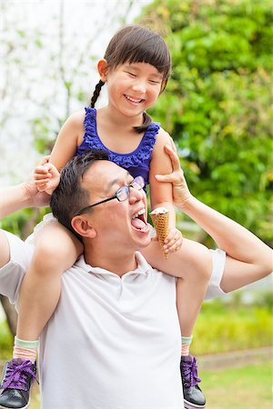 happy little Girl  Eating Ice Cream with father Stock Photo - Budget Royalty-Free & Subscription, Code: 400-07517977