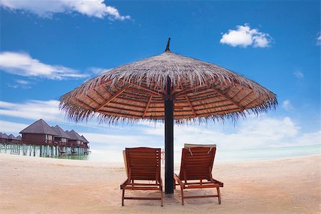 paradise background - water villa with umbrella and beach chair .maldives Stock Photo - Budget Royalty-Free & Subscription, Code: 400-07518002