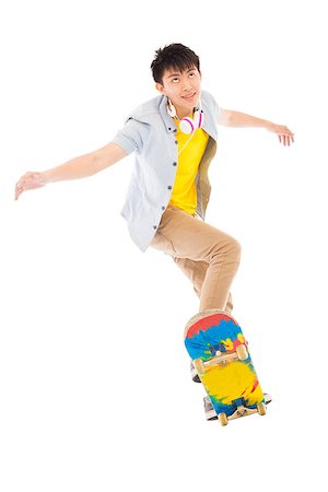 young man Skateboard to jump isolated on white background Stock Photo - Budget Royalty-Free & Subscription, Code: 400-07518046