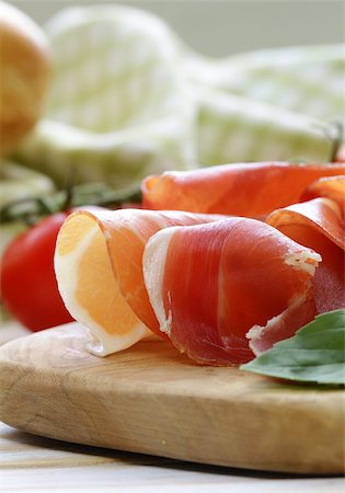 simsearch:400-06063216,k - parma ham (jamon) sliced on a wooden board Fotografie stock - Microstock e Abbonamento, Codice: 400-07518525