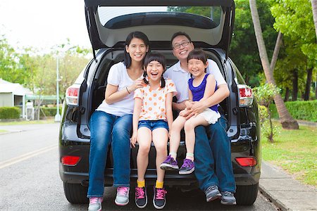 father car home - happy family sitting in the car and their house behind Stock Photo - Budget Royalty-Free & Subscription, Code: 400-07518607