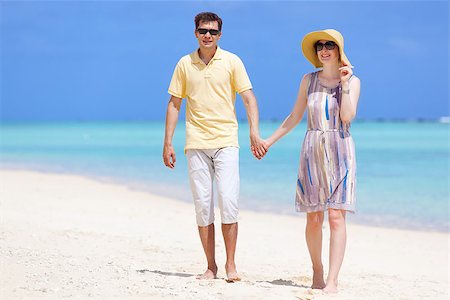 young couple at the beach, holding hands together Stock Photo - Budget Royalty-Free & Subscription, Code: 400-07518793