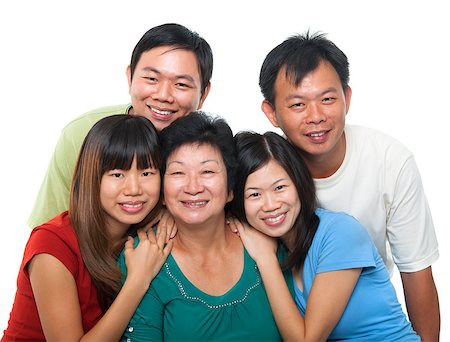 simsearch:400-04400433,k - Asian family portrait. Happy senior mother and her adult offsprings, smiling isolated on white background. Stock Photo - Budget Royalty-Free & Subscription, Code: 400-07518984