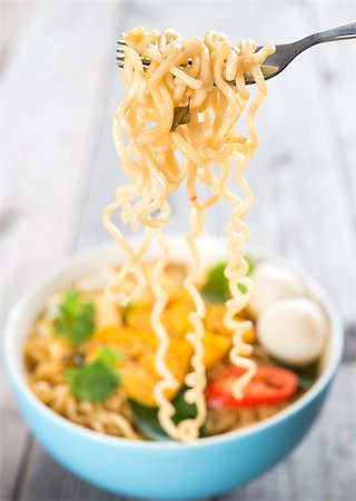 simsearch:400-05297094,k - Hot and spicy instant noodles soup, in curry flavour. Fotografie stock - Microstock e Abbonamento, Codice: 400-07519004