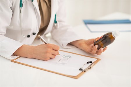simsearch:400-07099832,k - Closeup on medical doctor woman writing prescription Stock Photo - Budget Royalty-Free & Subscription, Code: 400-07519155