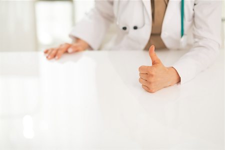 Closeup on medical doctor woman showing thumbs up Stock Photo - Budget Royalty-Free & Subscription, Code: 400-07519156