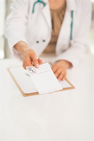simsearch:400-07099832,k - Closeup on medical doctor woman giving prescription Stock Photo - Budget Royalty-Free & Subscription, Code: 400-07519151