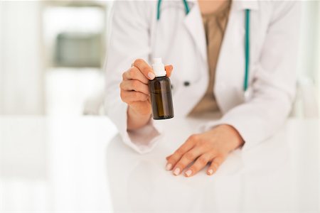 simsearch:400-07099832,k - Closeup on medical doctor woman showing medicine bottle Stock Photo - Budget Royalty-Free & Subscription, Code: 400-07519162