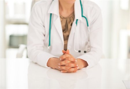 simsearch:400-07519214,k - Closeup on medical doctor woman sitting in office Stock Photo - Budget Royalty-Free & Subscription, Code: 400-07519204