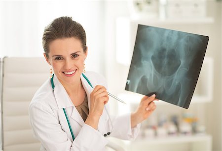 simsearch:400-07099823,k - Portrait of happy medical doctor woman holding fluorography Stock Photo - Budget Royalty-Free & Subscription, Code: 400-07519215