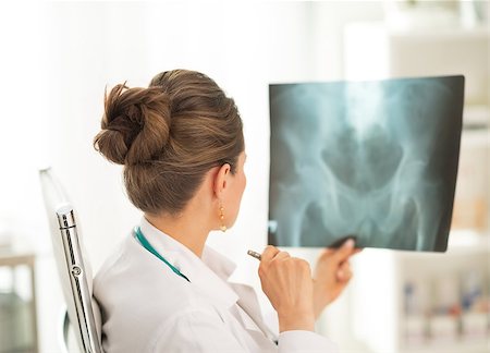 simsearch:400-07519214,k - Medical doctor woman looking on fluorography. rear view Stock Photo - Budget Royalty-Free & Subscription, Code: 400-07519217