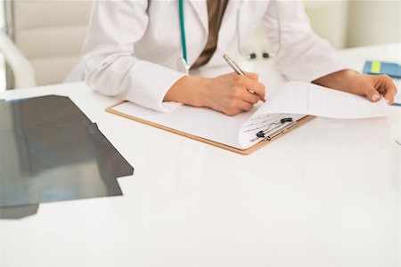 simsearch:400-07519214,k - Closeup on medical doctor woman working in office Stock Photo - Budget Royalty-Free & Subscription, Code: 400-07519210
