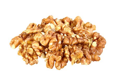 simsearch:400-07210943,k - Heap of beige walnuts isolated on white background. Close-up. Studio photography. Fotografie stock - Microstock e Abbonamento, Codice: 400-07510380