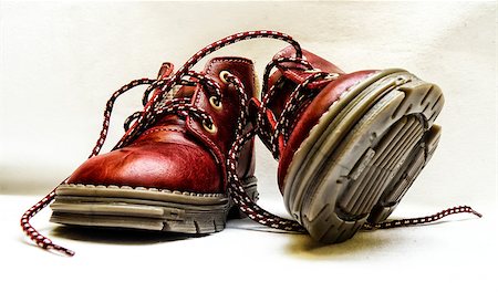 red baby or kid shoes on white background Foto de stock - Super Valor sin royalties y Suscripción, Código: 400-07510498