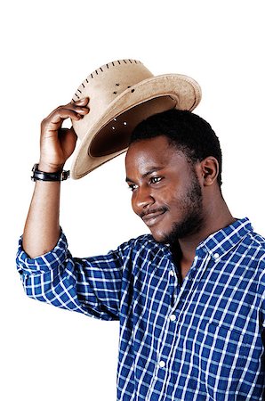 A handsome black man in a blue shirt lifting his cowboy hat and smiling isolated for white background. Stock Photo - Budget Royalty-Free & Subscription, Code: 400-07510562