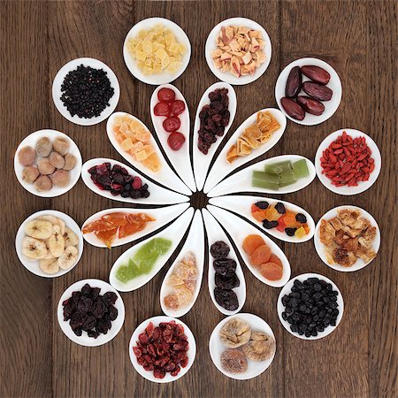 simsearch:400-04180777,k - Dried fruit selection in white bowls over old oak background. Photographie de stock - Aubaine LD & Abonnement, Code: 400-07510828