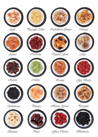 Large dried fruit selection in white bowls on slate rounds over white background with titles Stock Photo - Budget Royalty-Free & Subscription, Code: 400-07510855