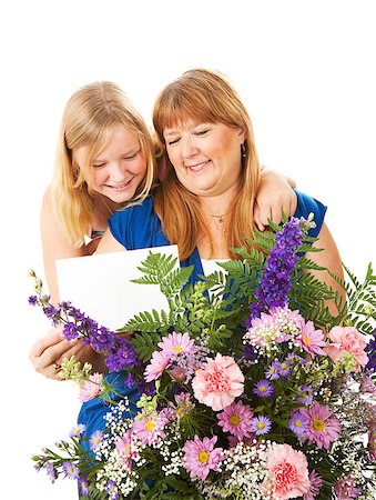 Mom receives flowers and a card from her daughter on Mother's Day.  Could also work as a birthday concept. Foto de stock - Super Valor sin royalties y Suscripción, Código: 400-07510933