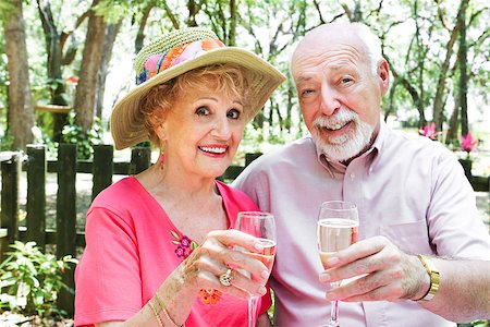 Senior couple drinking champagne together outdoors in a picnic setting. Stock Photo - Budget Royalty-Free & Subscription, Code: 400-07510945