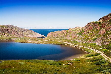 Mountain lake in the North. Moss-covered hills, and stunted vegetation. The Kola Peninsula. Fotografie stock - Microstock e Abbonamento, Codice: 400-07511319