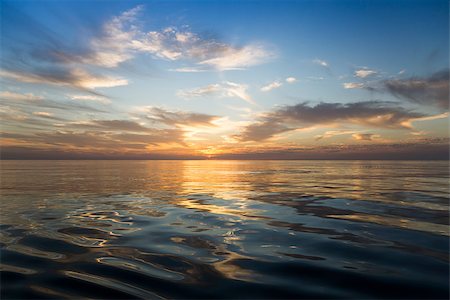 Beautiful sunrise over the sea. Calm. Fotografie stock - Microstock e Abbonamento, Codice: 400-07511311