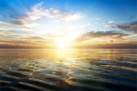 Beautiful sunrise over the sea. Calm. Fotografie stock - Microstock e Abbonamento, Codice: 400-07511312