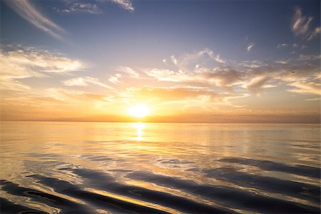 Beautiful sunrise over the sea. Calm. Fotografie stock - Microstock e Abbonamento, Codice: 400-07511313