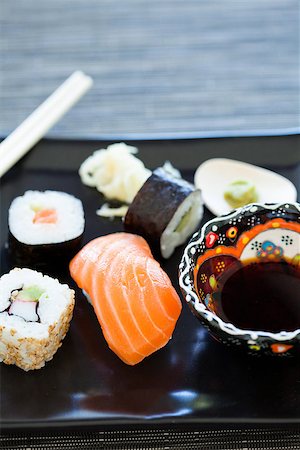 simsearch:689-03123940,k - Closeup of plate of healthy freshly prepared sushi with bowl soy sauce Photographie de stock - Aubaine LD & Abonnement, Code: 400-07511350