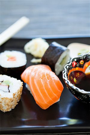 simsearch:689-03123940,k - Closeup of plate of healthy freshly prepared sushi with bowl soy sauce Photographie de stock - Aubaine LD & Abonnement, Code: 400-07511351
