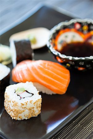 simsearch:689-03123940,k - Closeup of plate of healthy freshly prepared sushi with bowl soy sauce Photographie de stock - Aubaine LD & Abonnement, Code: 400-07511353